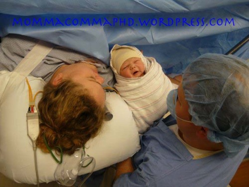 What we were doing while Mabel's cord blood was being collected:  "Meet" for the first time in the OR.