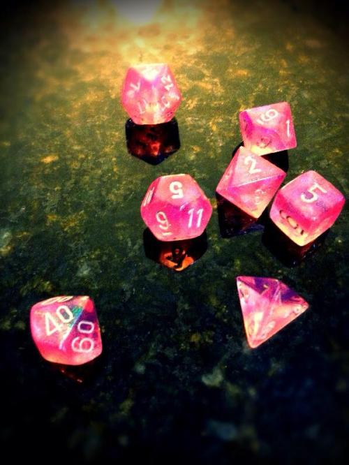 A very special time in a young girl's life - her first gaming dice. (First d20 roll was a 17)